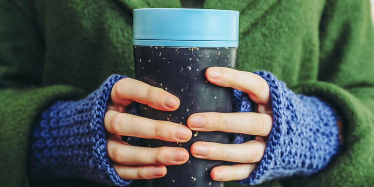 Person-holding-Circular-&-Co-coffee-cup-that-is made-within-the-circular-economy