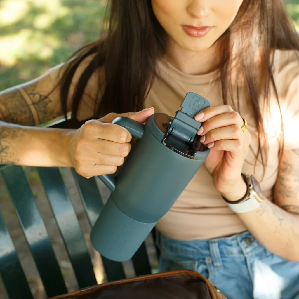 Brumate-Muv-25oz-Lifestyle-Image-Woman-in-the-Park-On-Bench