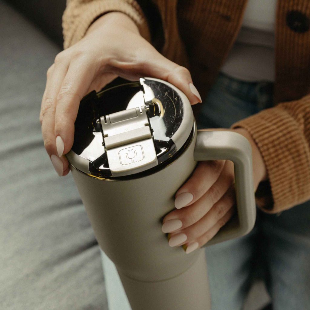 Brumate-Muv35-Woman-Sitting-Down-Holding-Bottle